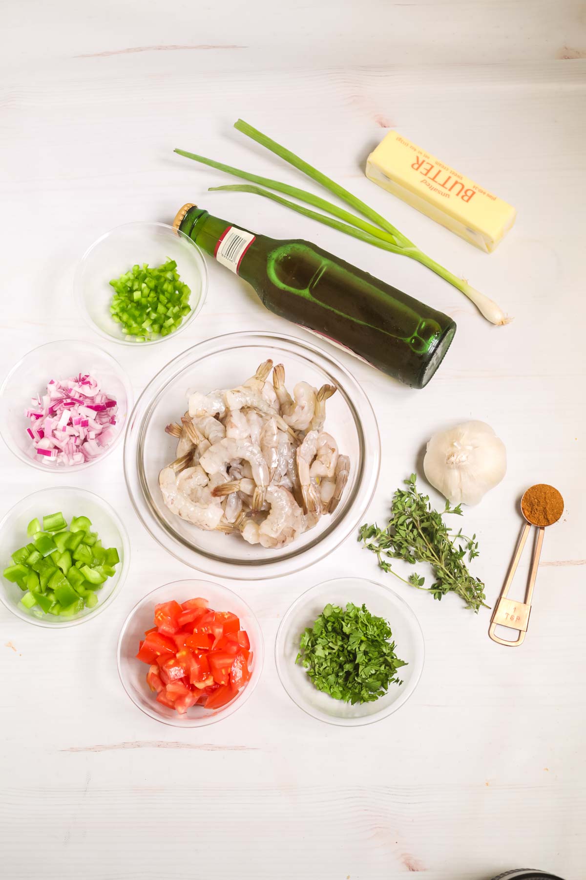 Bowl of shrimp, onions, peppers, garlic and seasonings for Jerked shrimp.