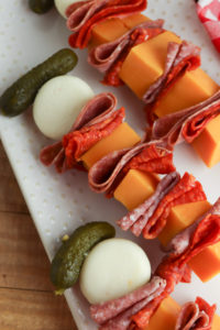 Charcuterie Skewers on a white plate.