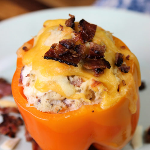 Bacon Ranch Chicken Stuffed Bell Peppers on a white plate.
