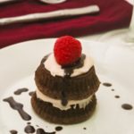 Chocolate Mocha Cakes with chocolate drizzle on a white dish.