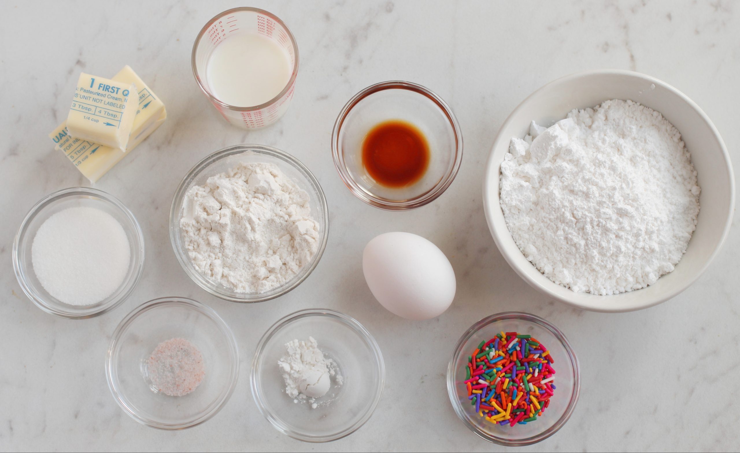 Flour, sprinkles, eggs for the funfetti mug cake.
