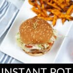 An Instant Pot Teriyaki Chicken Sandwich with lettuce and tomato on a sesame bun, served alongside sweet potato fries on a white rectangular plate.