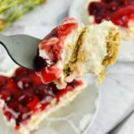 No Bake Cherry Cheesecake with a piece on a fork.
