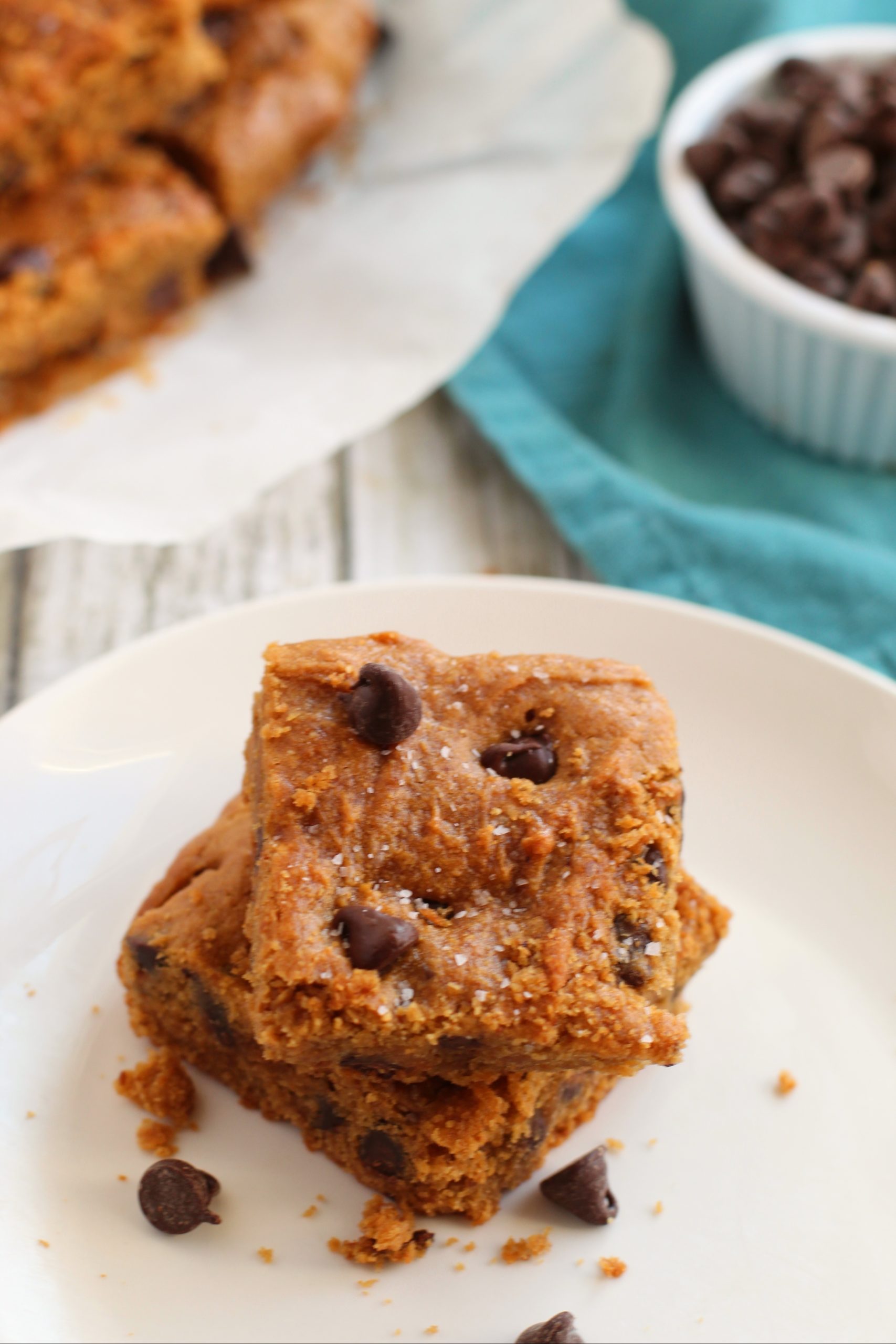 Peanut Butter Blondies with a blue napkin in the background.