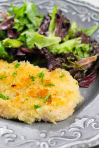 milanese chicken recipe with a side salad.