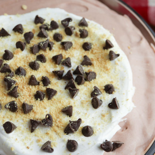 Fluffy Chocolate Dip topped with whipped cream and chocolate chips.