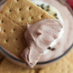 Fluffy Chocolate Dip with a graham cracker dipped in it.