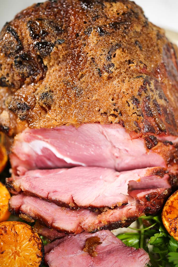 close up of the ham with several slices taken out.