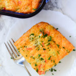 Mexican Breakfast Casserole with a full casserole in a blue dish in the background.