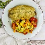 Baked fish with corn salsa.
