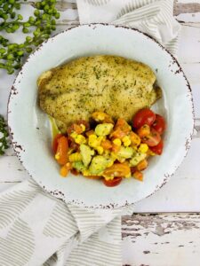 Baked fish with corn salsa.