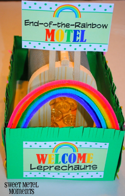Small green box baited with gold and decorated with rainbows.