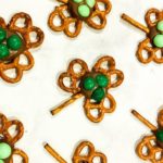 Easy Shamrock Pretzels with two different colored green M&Ms on them.