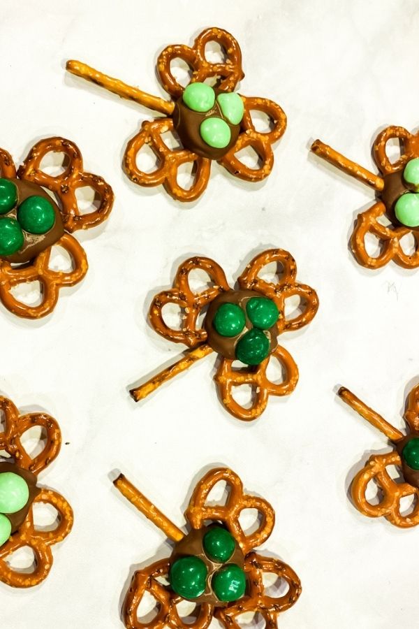 Easy Shamrock Pretzels with two different colored green M&Ms on them.