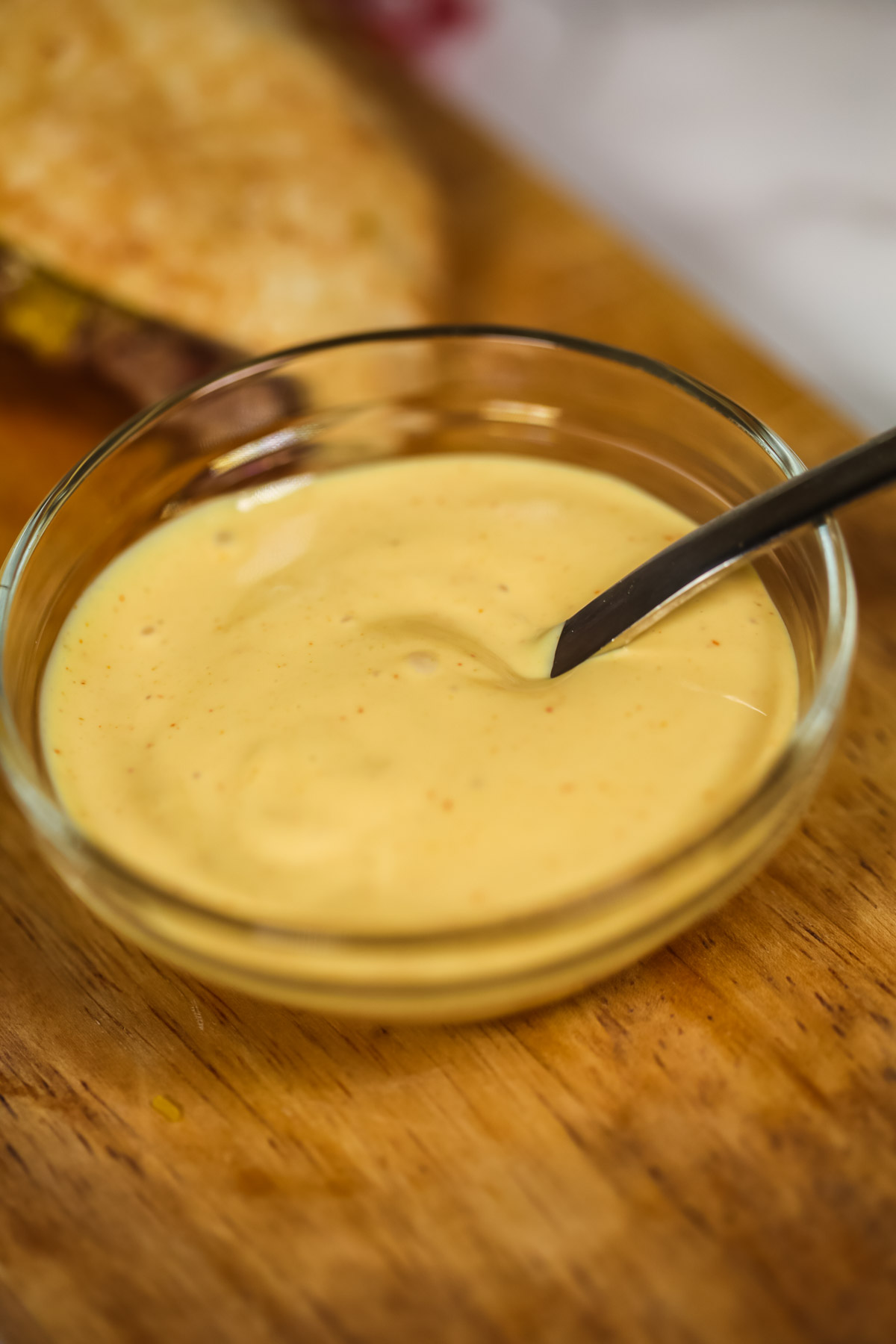  Best Burger Sauce in a clear bowl with a spoon.