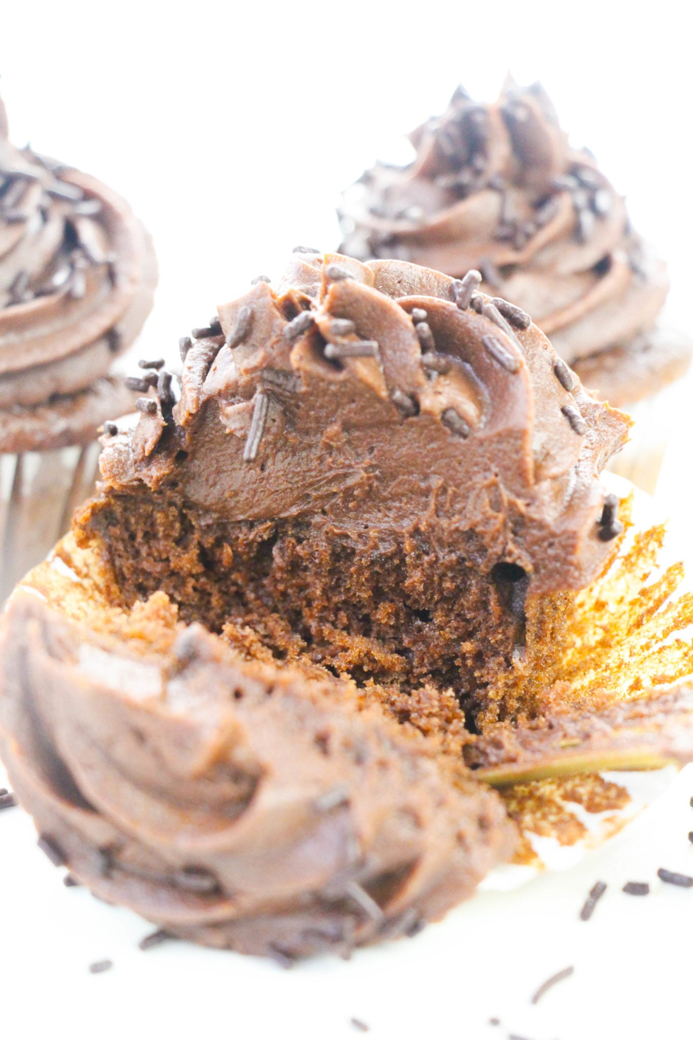 A cupcake cut in falf to show the tender middle.