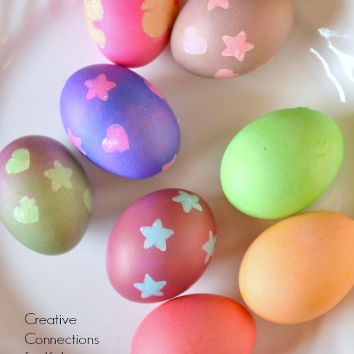Colorful eggs decorated with shapes including hearts and stars.