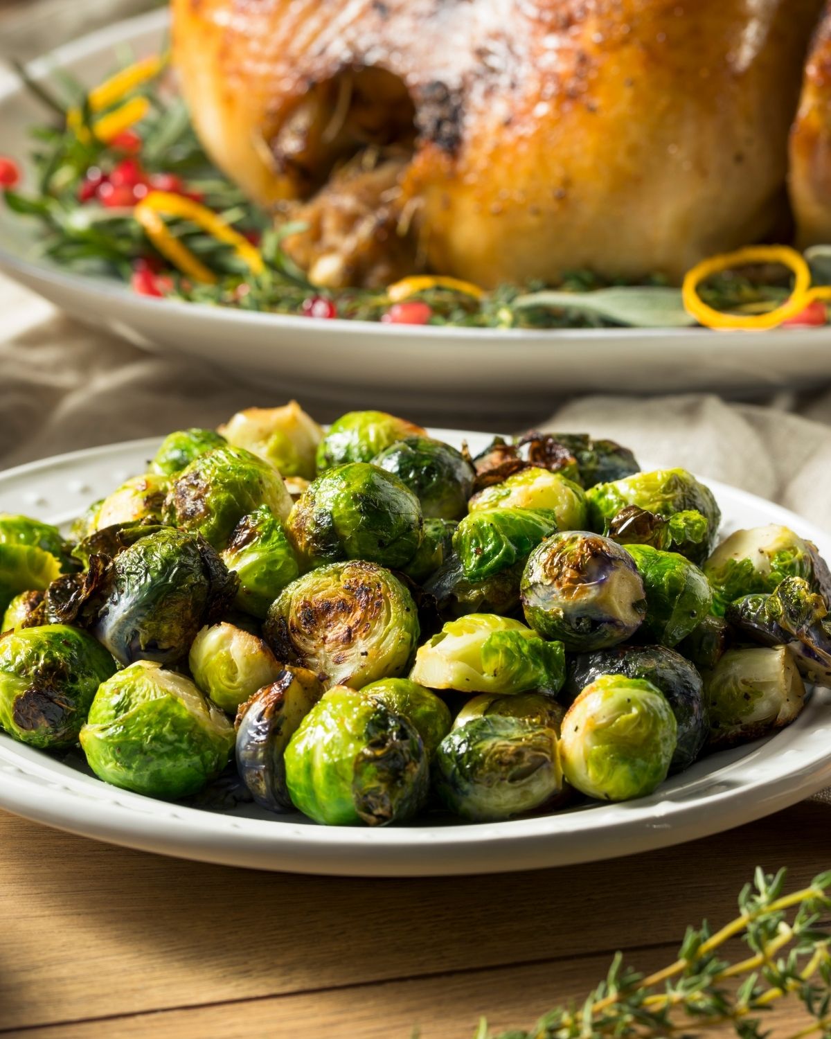 Garlic Parmesan Brussel Sprouts  on a table with dinner items.
