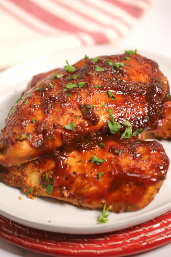 Side view of a plate of Instant Pot Barbecue Chicken.