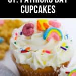 A delightful cupcake adorned with white frosting, rainbow and horseshoe cereal toppings, and colorful sprinkles captures the essence of St. Patrick's Day magic.