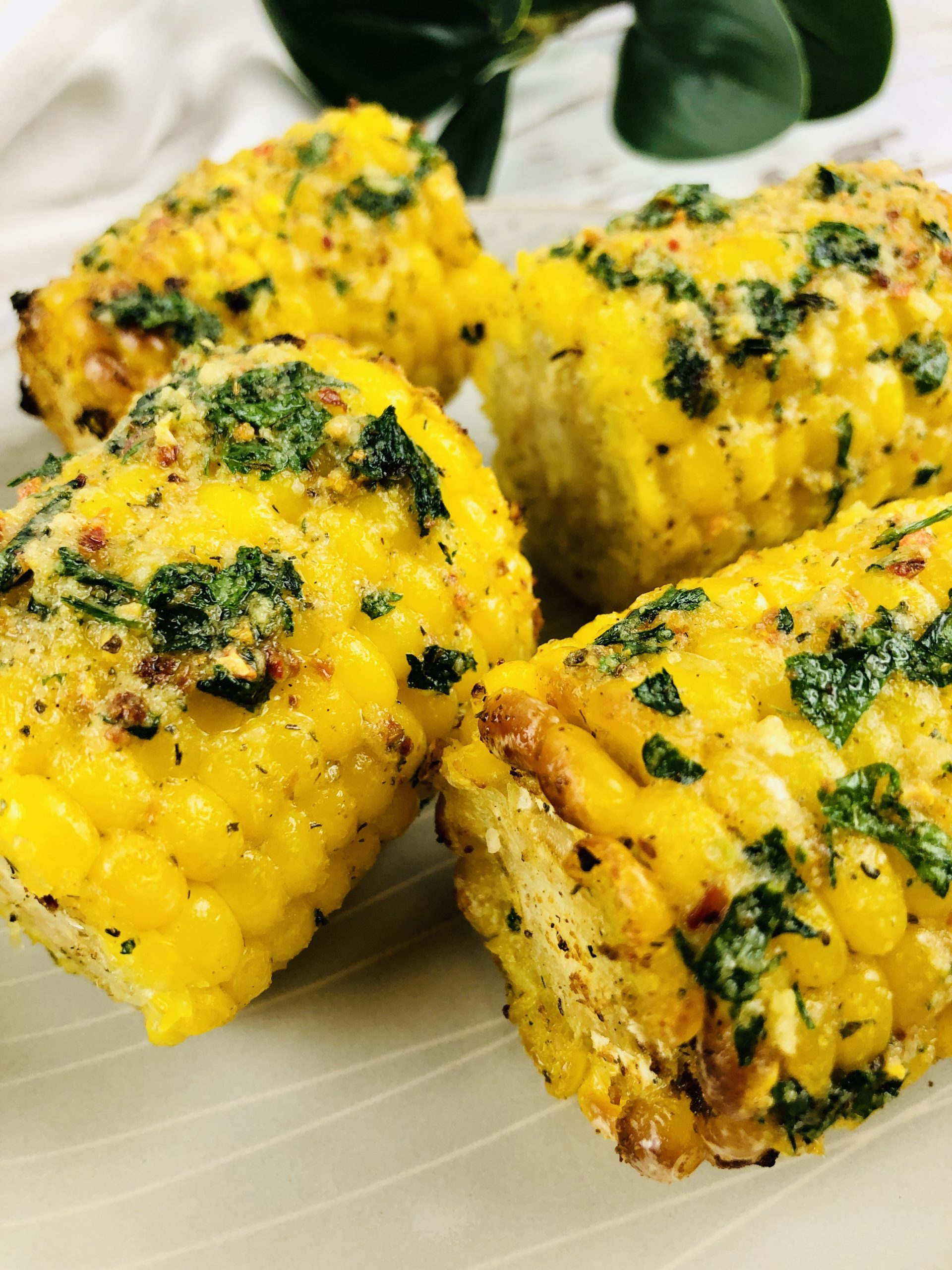 Air Fryer Corn with Herb Butter stacked together.