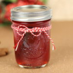 Cranberry moonshine with cinnamon sticks on the side.