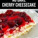 A slice of No Bake Cherry Cheesecake topped with cherry filling, layered over a creamy base and graham cracker crust, served on a light-colored plate.