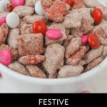 A bowl of red velvet Chex muddy mix brimming with pink, red, and white candies. Text at the bottom reads: "Festive Chex Muddy Recipe.