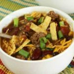 Slow Cooker Taco Chili in a top shot with a colored mat.
