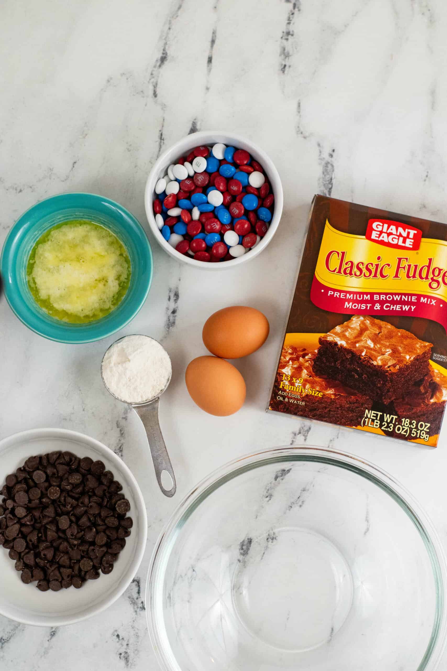 A box of brownie mix, candies and eggs for the 4th of July Cookies.