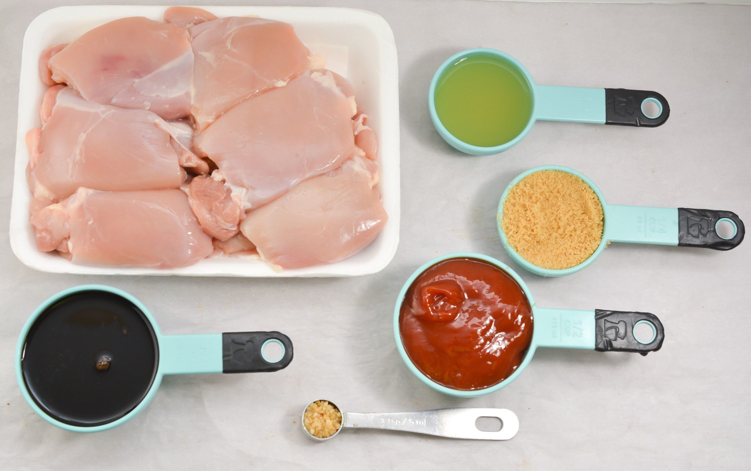 Raw chicken and sauce ingredients.