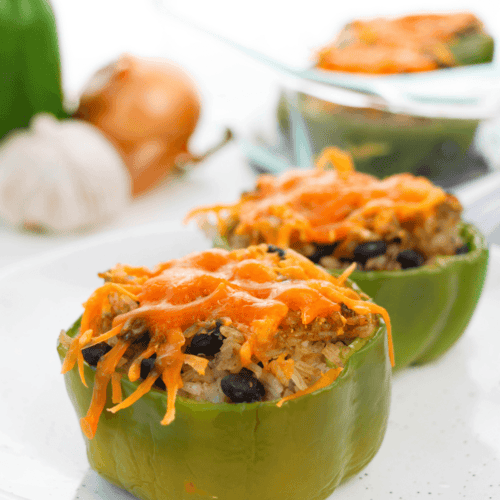 A black bean stuffed pepper on a white plate.