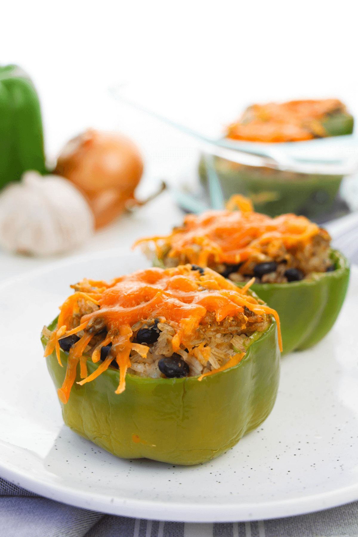 A black bean stuffed pepper on a white plate.