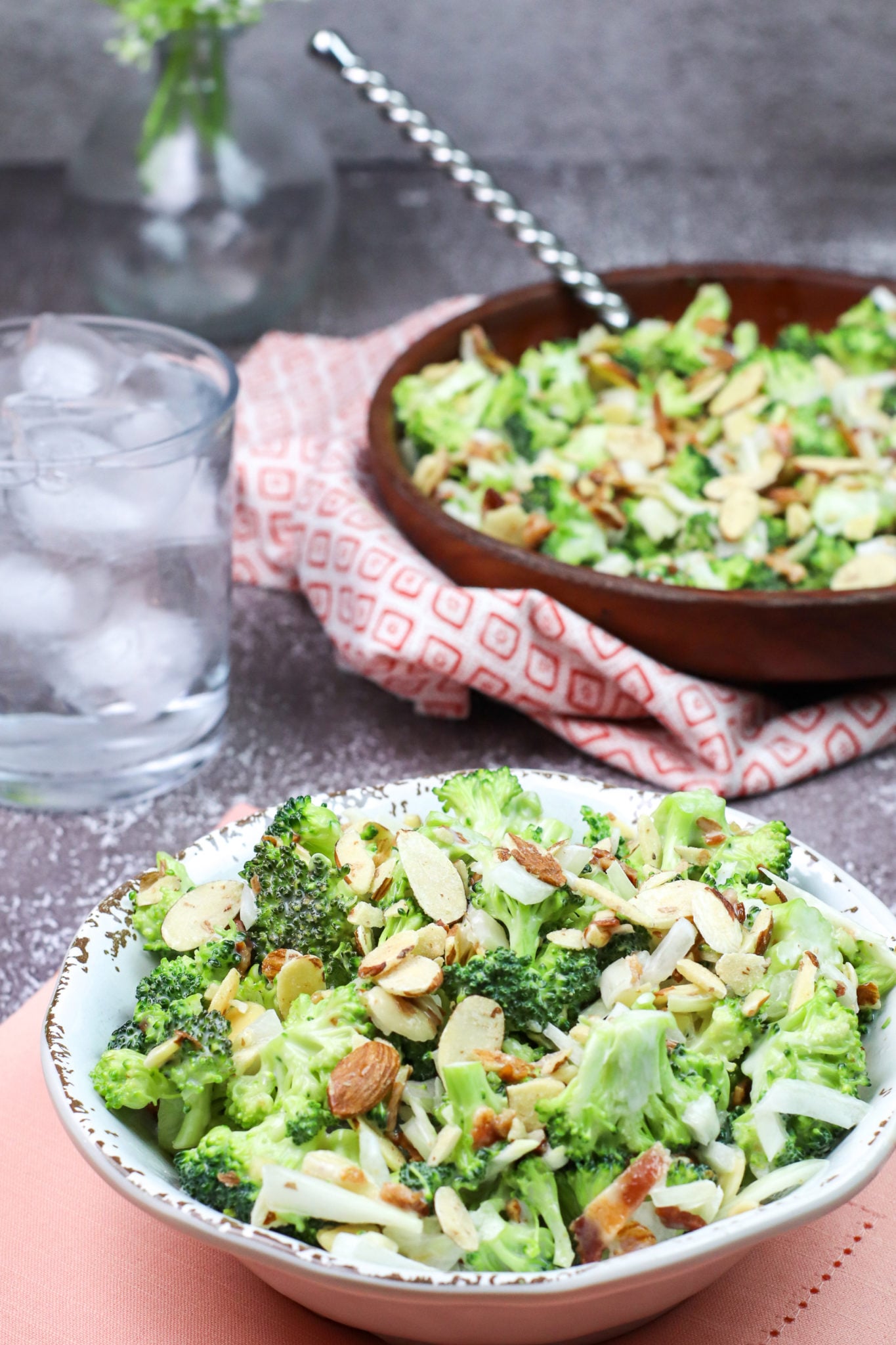 A large bowl of the salad with a serving bowl.
