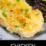 Chicken Milanese: Breaded and baked chicken breast garnished with parsley, served alongside leafy greens on a gray plate.