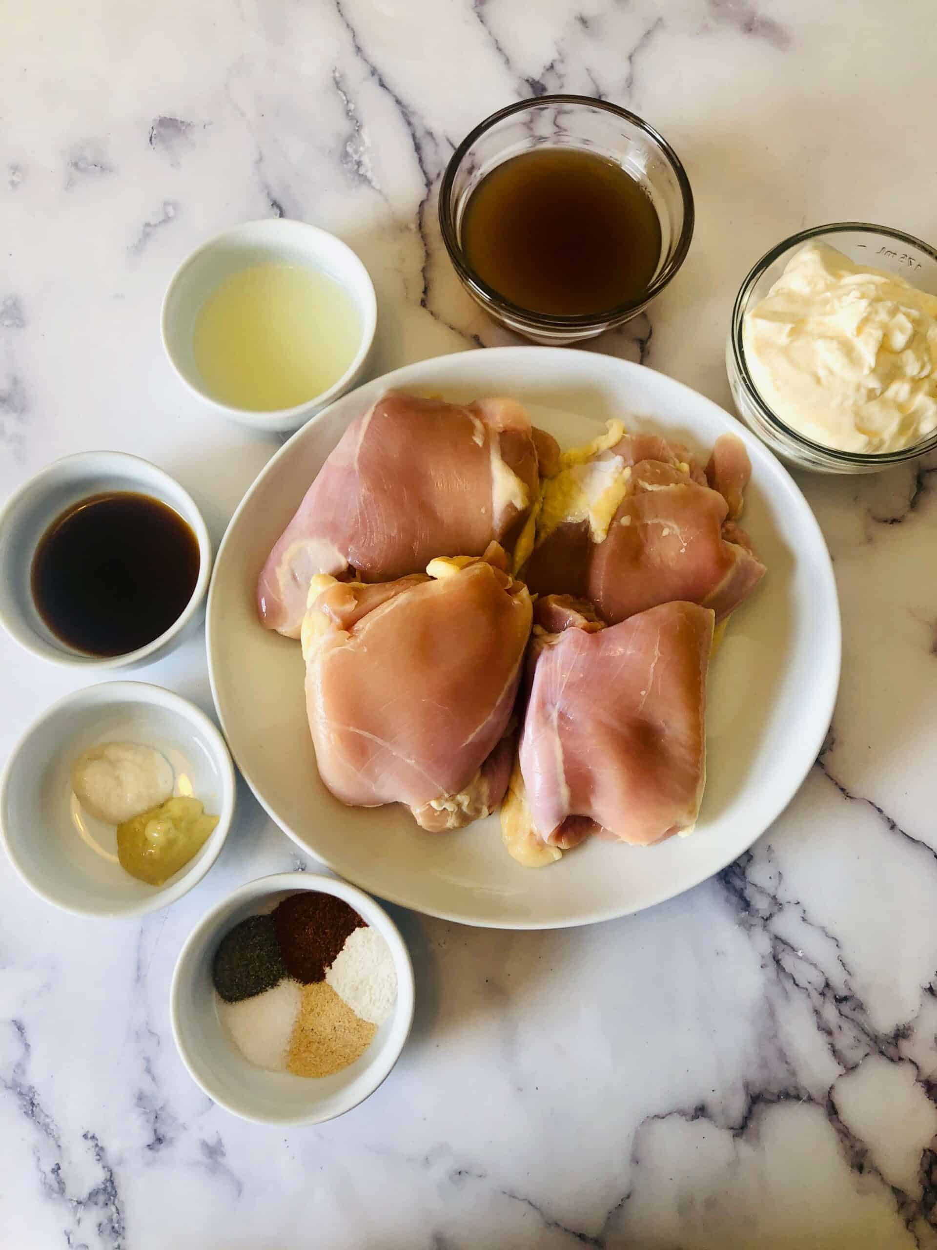 Chicken pieces and the ingredients to make the sauce.