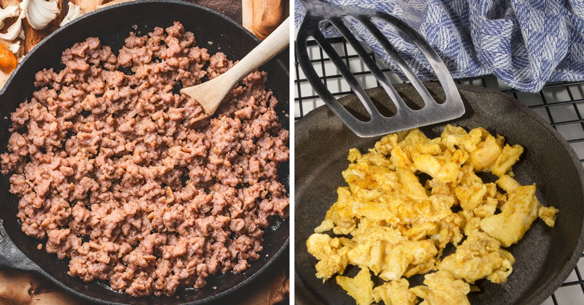 Two frying pans on a stove with cooked sausage in one and scrambled eggs in the other.