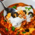 A spoonful of spicy chili, reminiscent of a dish.