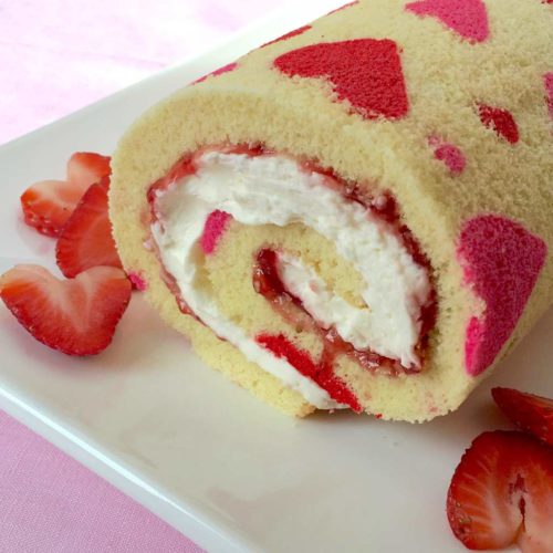 Heart decorated strawberry cake roll