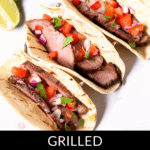 Savor the flavors of steak street tacos with three grilled delights featuring sliced meat, diced tomatoes, onions, and fresh cilantro on warm tortillas, accompanied by zesty lime wedges. Text reads "Grilled Steak Street Tacos.