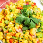 Sweet Grilled Corn Salad in a clear bowl.