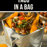 A "Taco in a Bag" featuring taco fillings like seasoned meat, cheese, tomatoes, and cilantro, served directly in an opened snack chip bag.