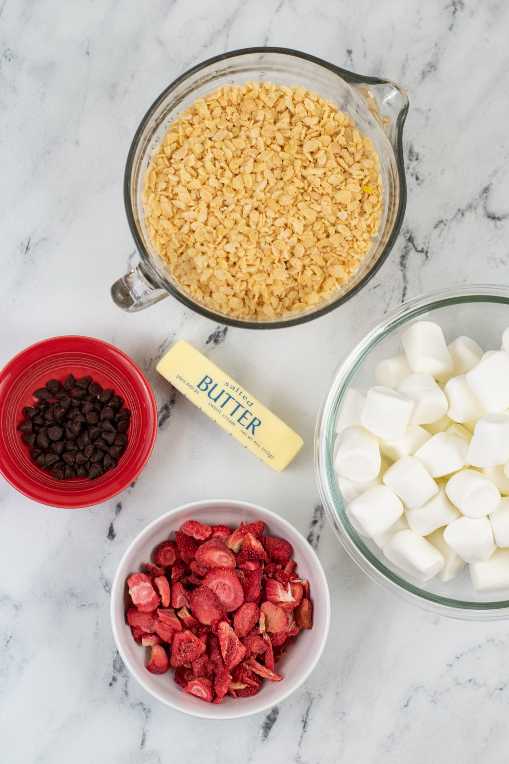 Cereal, freeze dried strawberries, butter, chocolate and marshmallows.