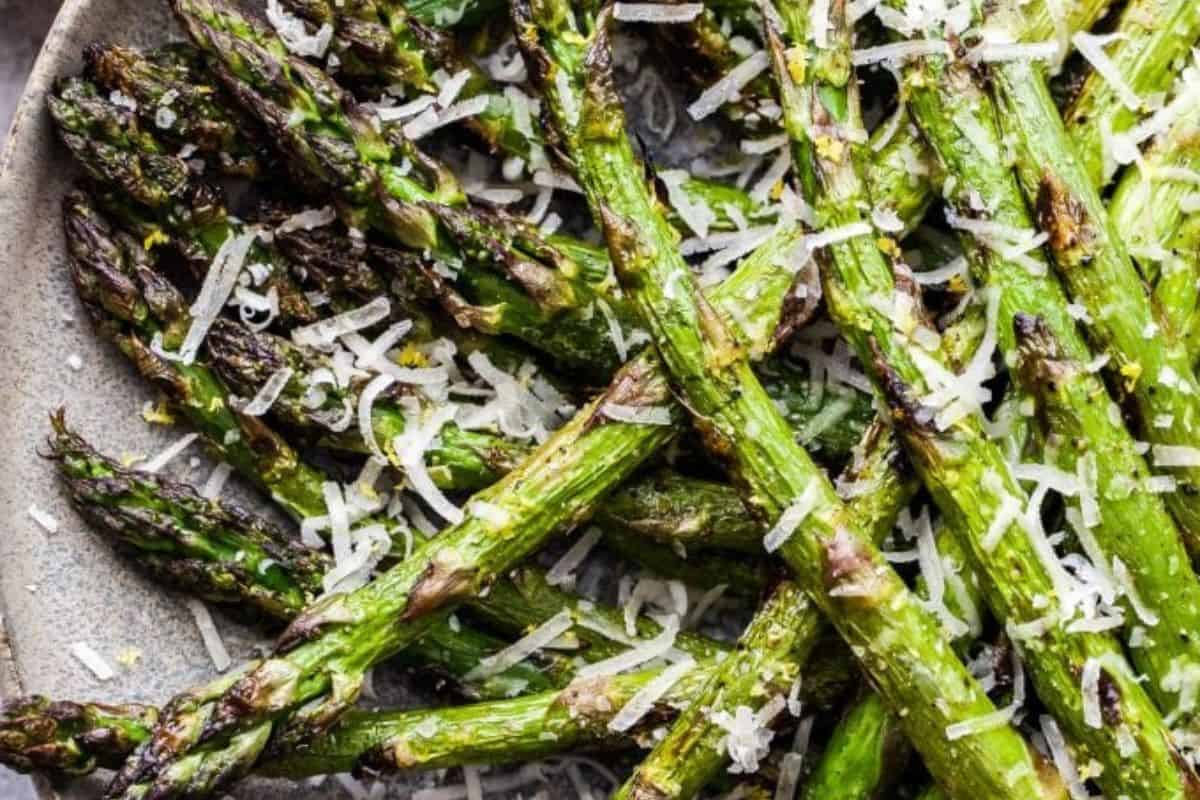 Grilled asparagus spears topped with grated Parmesan cheese and a squeeze of fresh lemon.