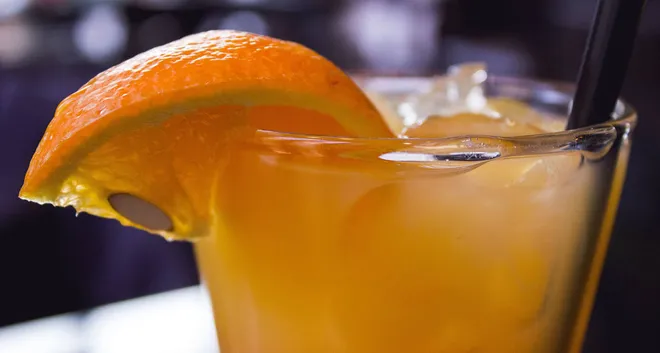a Georgia Gin Cocktail garnished with an orange