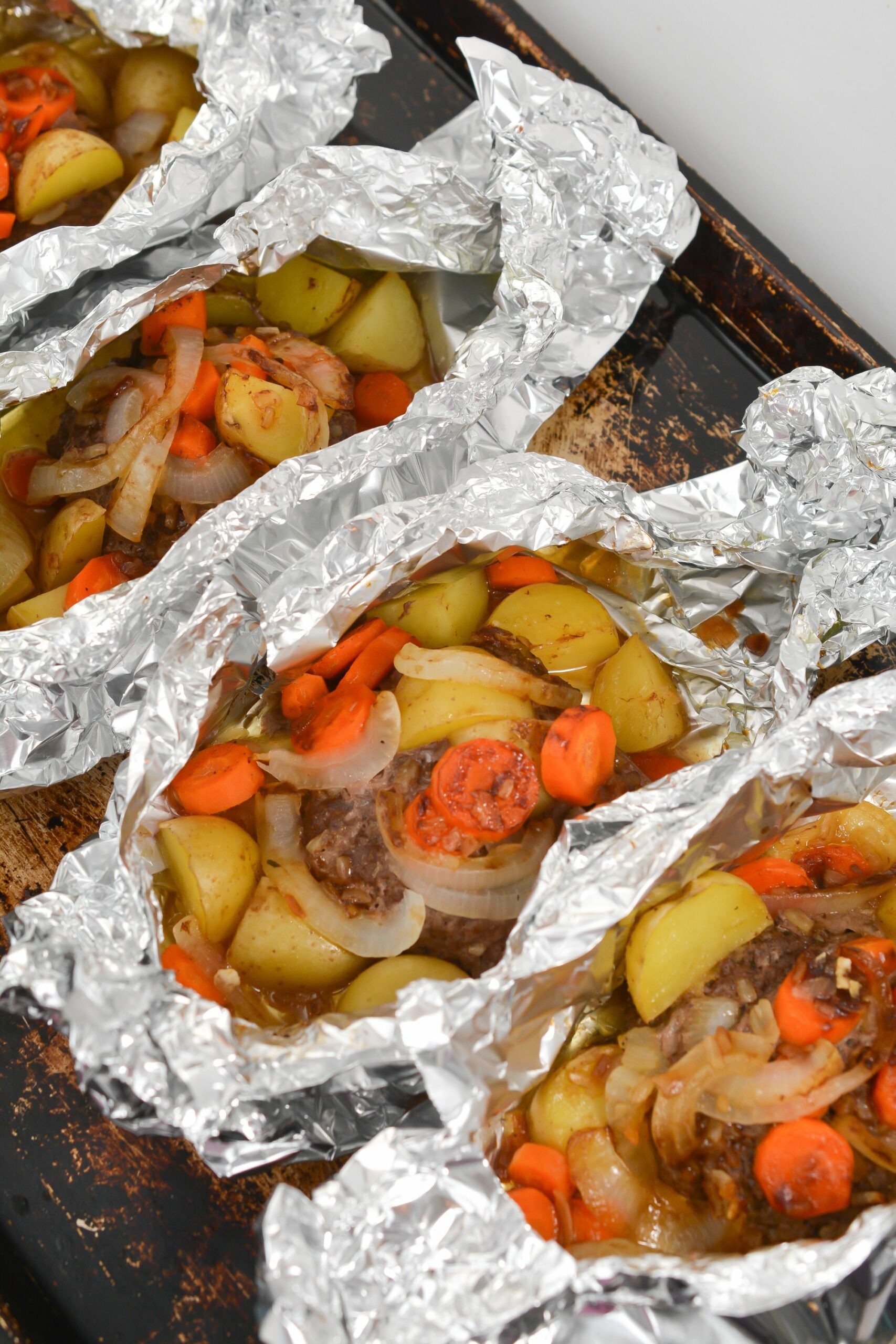 Several packets of the Beef and Vegetable Hobo Dinners.