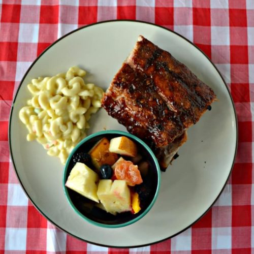 Bourbon Ribs on a plate with mac and cheese and fruit