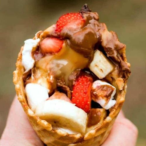 S'mores cone with fruit and chocolate and marshmallows sticking out the top