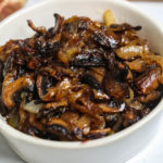 A white dish of the mushrooms and onions.