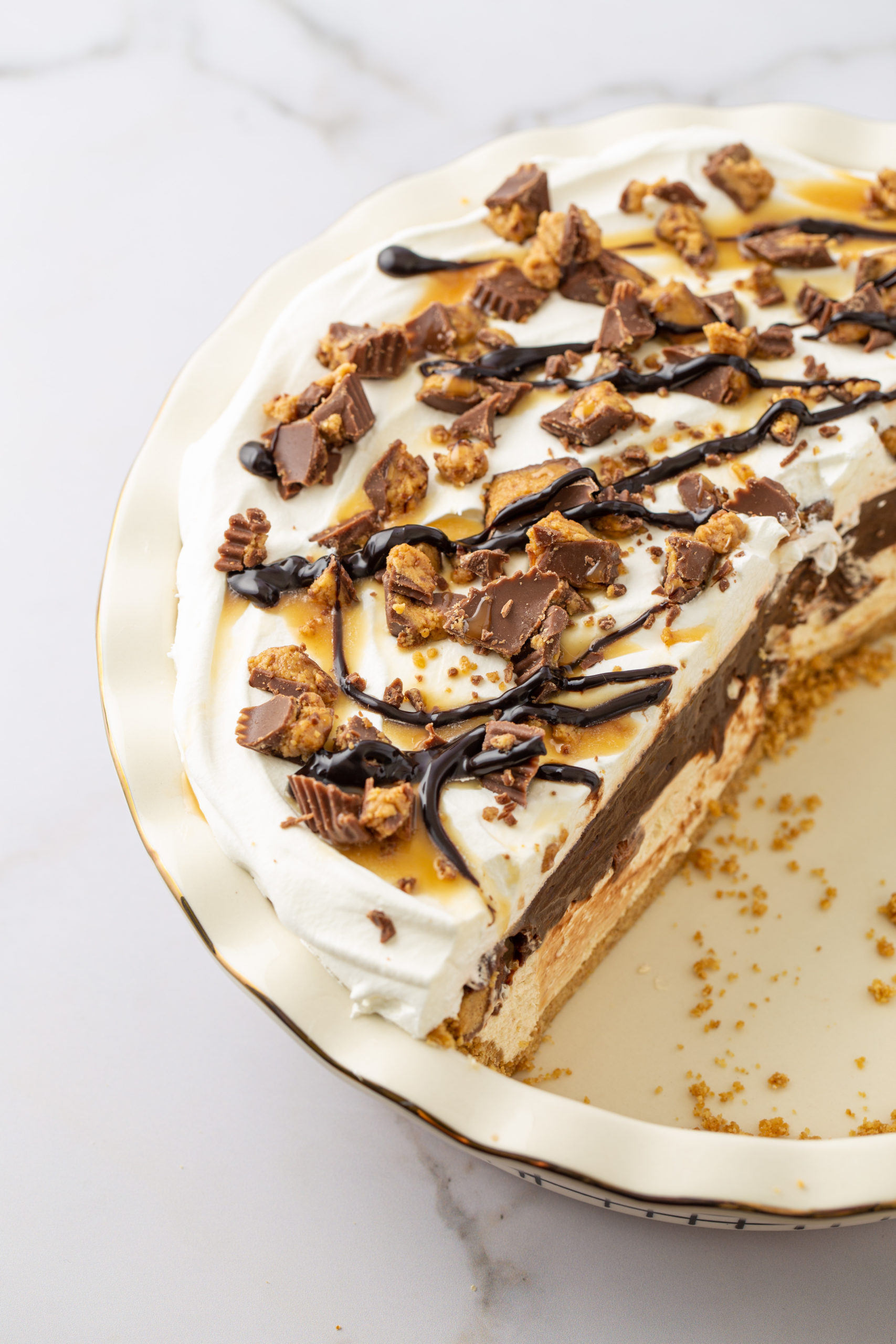 Chocolate Peanut Butter Pie with a slice cut out.